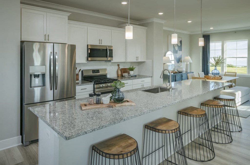 a large white kitchen with a counter top
