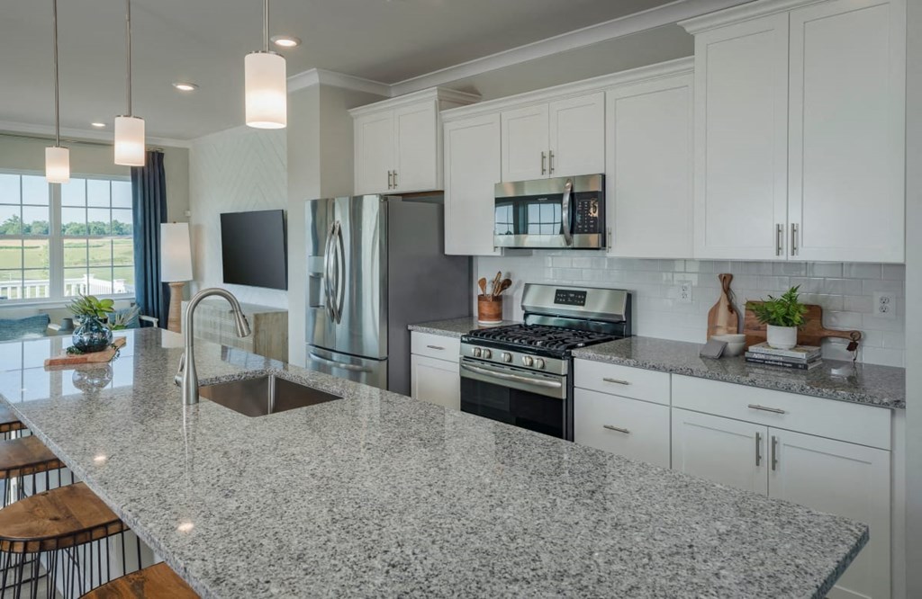 a view of a kitchen with white counter tops and