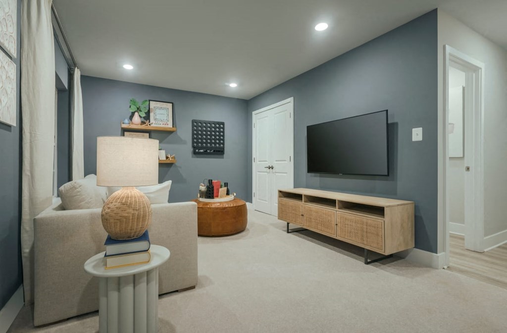 a living room with a couch and a tv