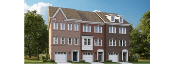 a red brick house with white garage doors