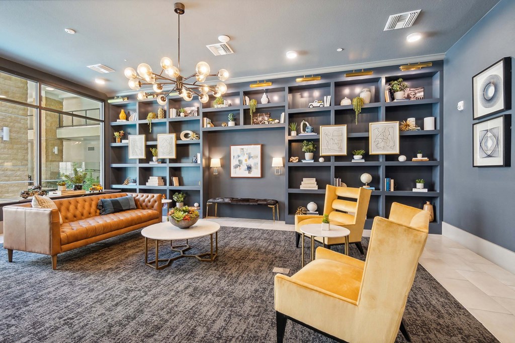 a living room with blue walls and yellow furniture