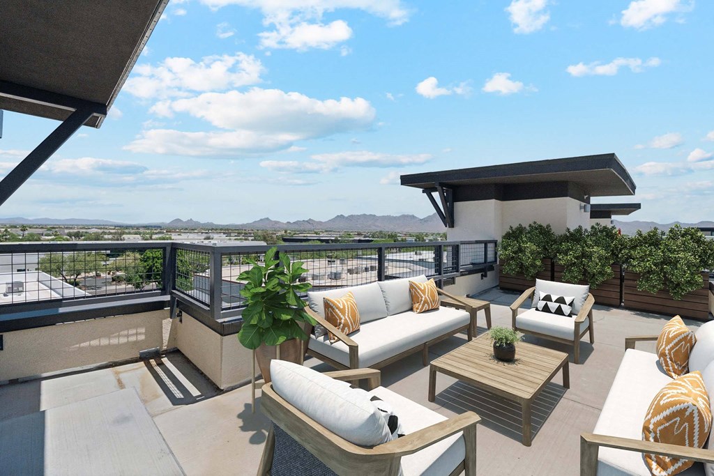 a furnished balcony with couches and a table