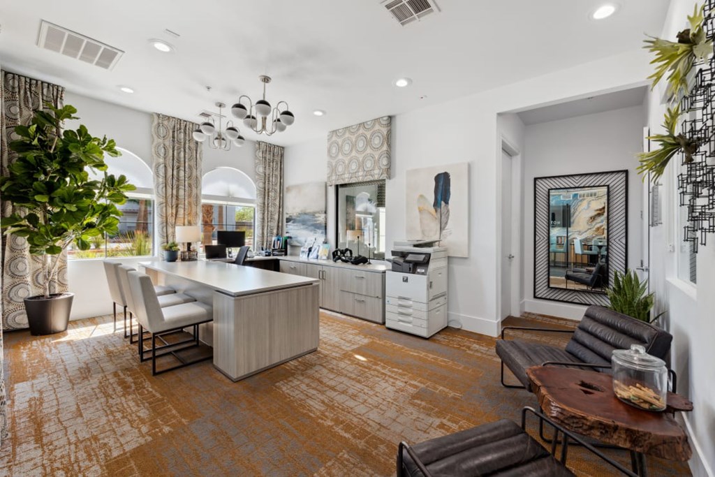 Colton Apartments A modern kitchen with a dining table and chairs.