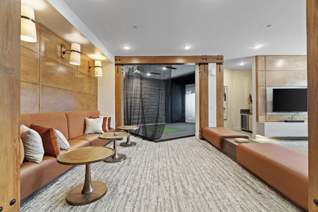 a living room with couches and a glass shower