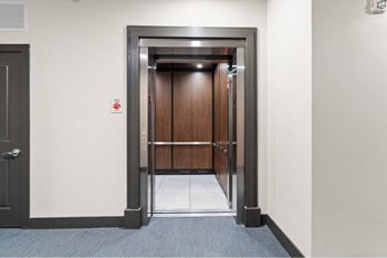 a view of an open elevator door in a building