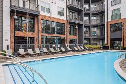 Skye Suwanee Town Center Apartments in Suwanee, Georgia Pool with Lounge Chairs