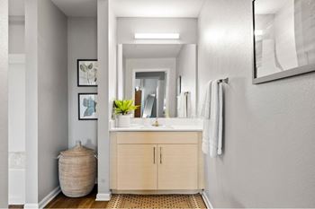 a bathroom with a sink and a mirror
