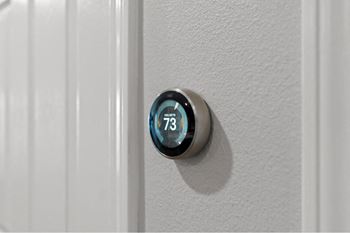 a digital thermostat on the side of a door