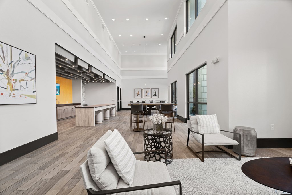 A modern living room with a white couch and a coffee table.
