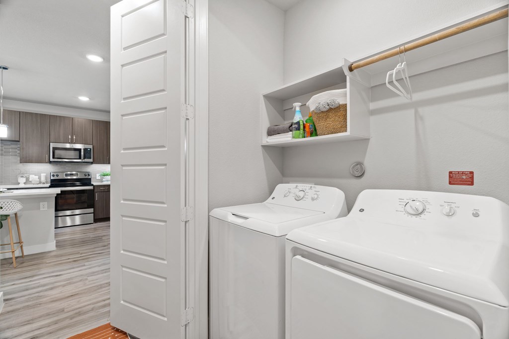 A white washer and dryer in a laundry room.