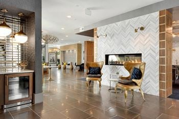 A modern living room with a fireplace and a TV.