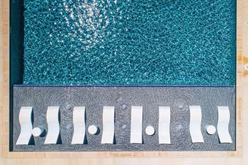 A pool with a metal grate over it.
