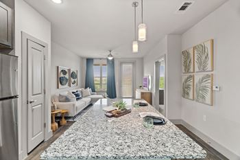 A modern living room with a large rug in the center.