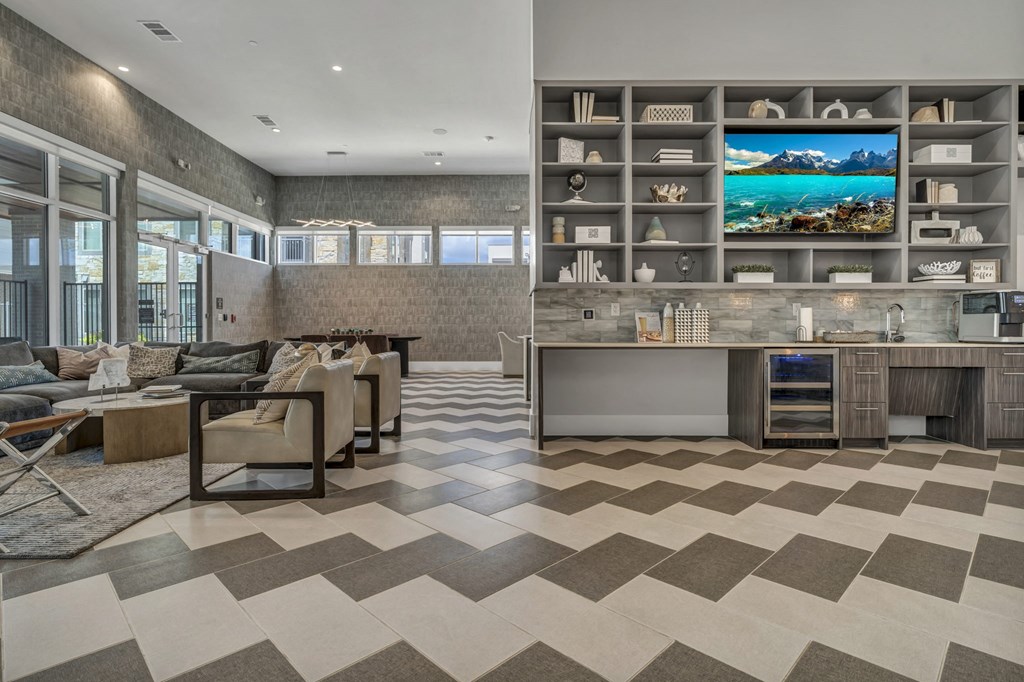A modern living room with a large TV and a checkered floor.