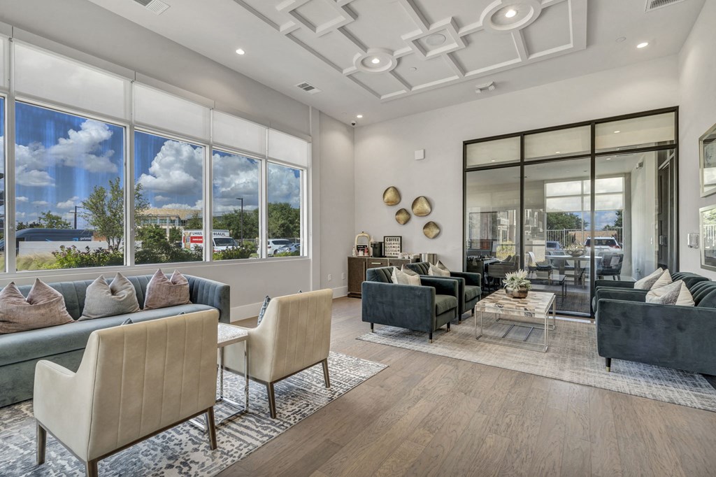 A modern living room with a large window and a view of the outdoors.