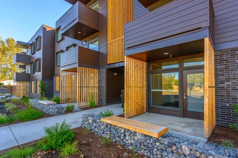 A modern building with wooden slats on the exterior.
