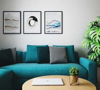 Model Living Room with Plants and Wall Art