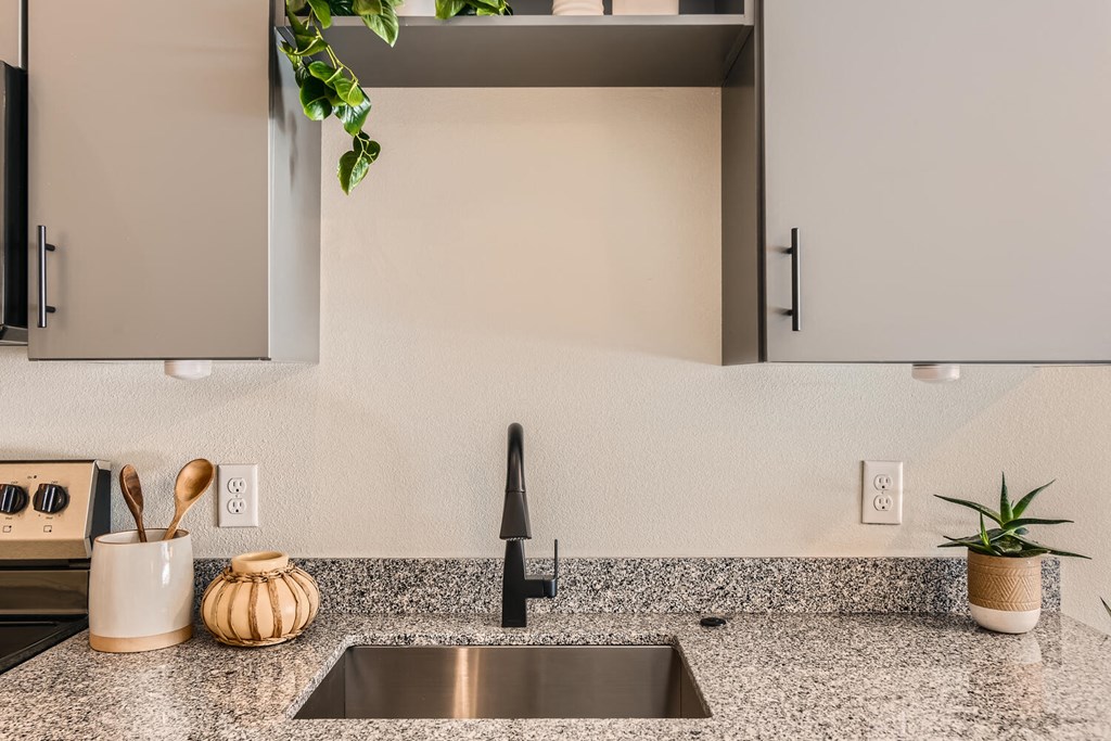 281 Willow Apartment kitchen with a sink and granite counter top