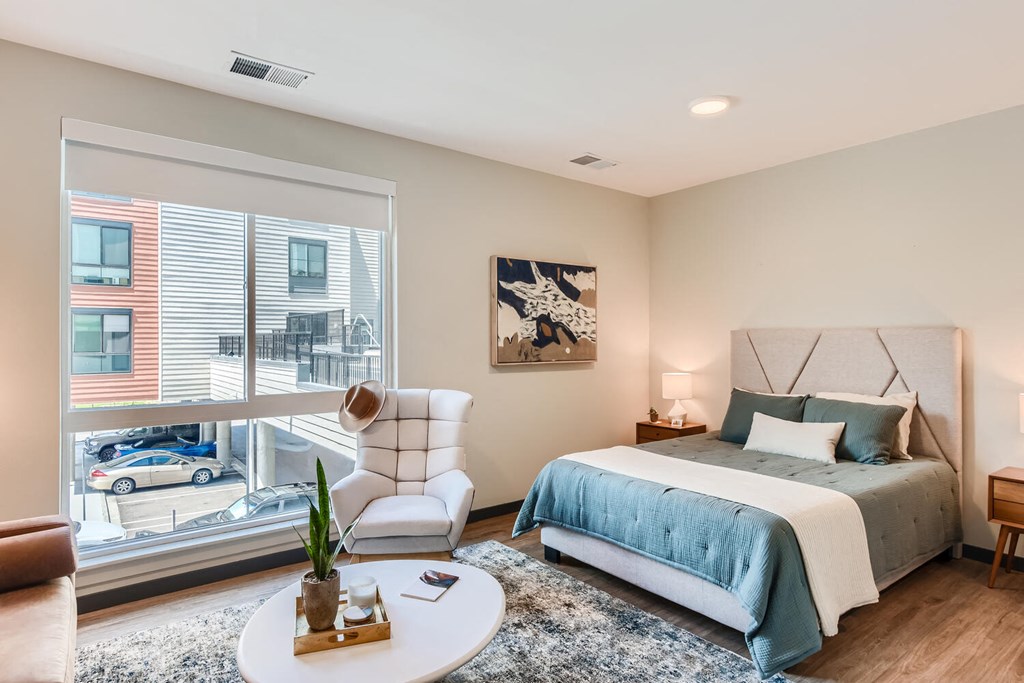 281 Willow Apartment bedroom with a large window and a bed
