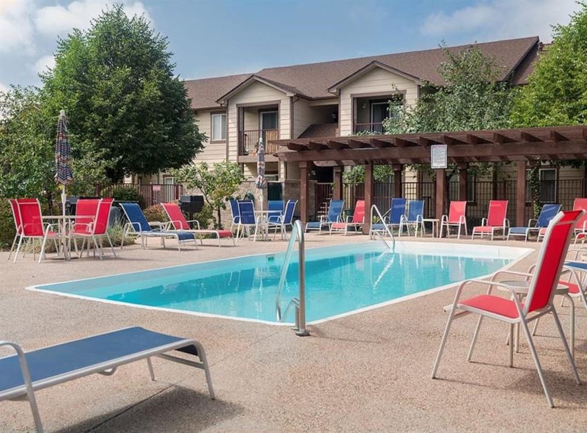 Reflections Apartments Pool with Lounge Chairs Reflections Apartments Pool with Lounge Chairs
