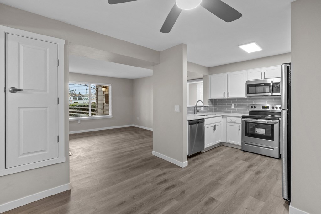 a kitchen and living room in a house