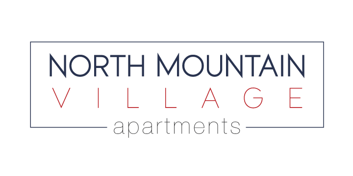 the logo for north mountain village appearing in the dark
