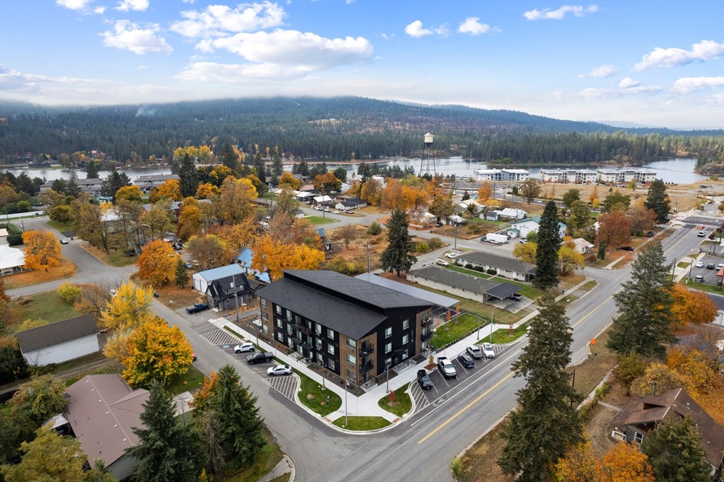 A large building with a parking lot in front of it.