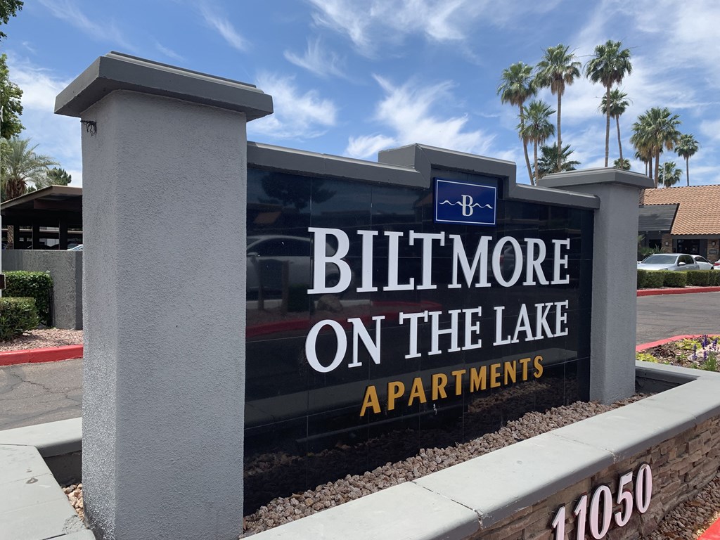 a sign that reads bill more on the lake apartments