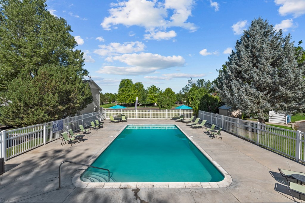 the swimming pool at woodland park apartments