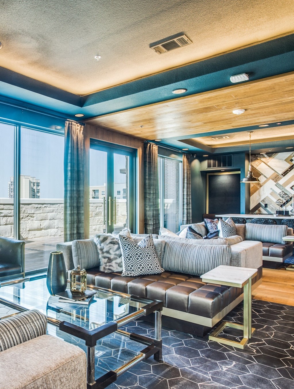 a living room filled with furniture and a large window