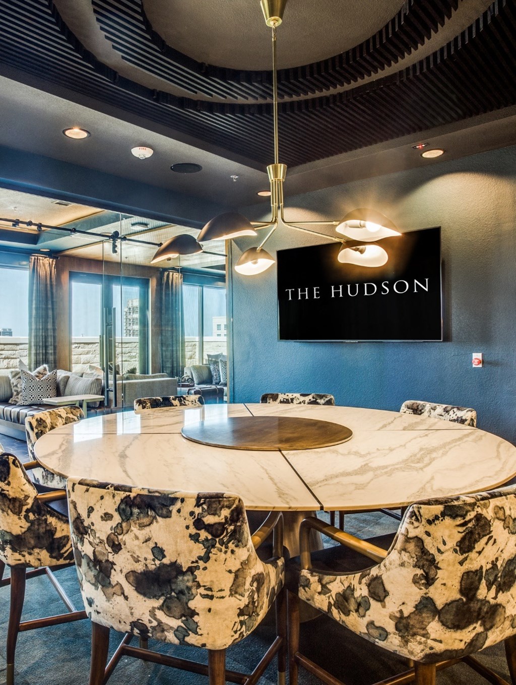 the hudson meeting room with a round table and chairs