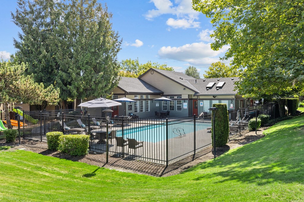 the preserve at ballantyne commons pool and fenced in yard with a house