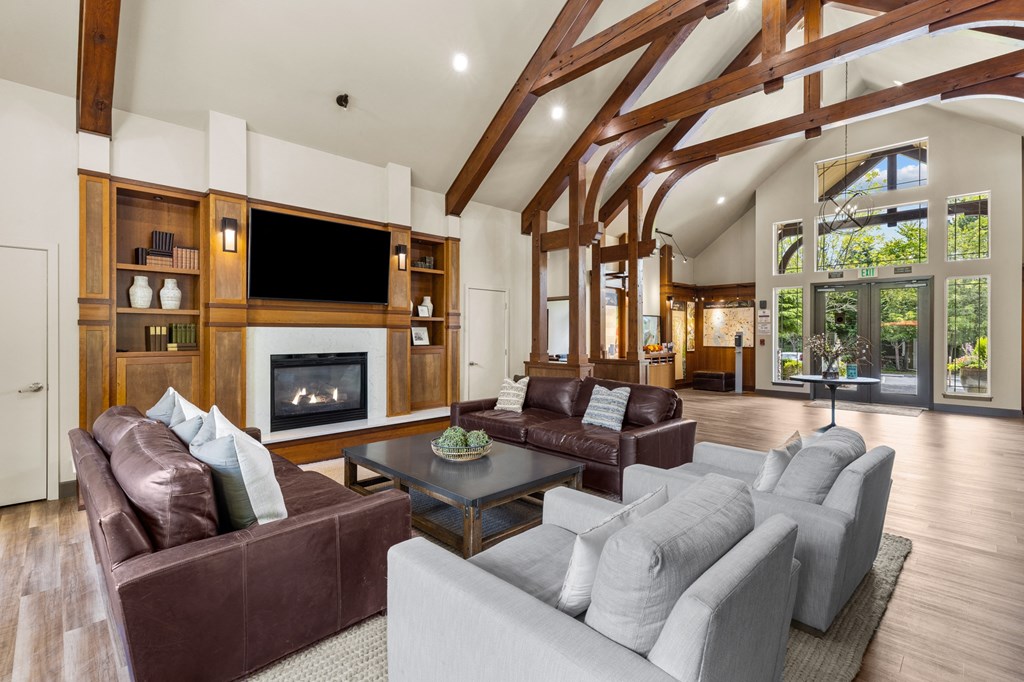 a living room filled with furniture and a fireplace