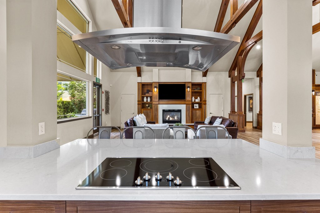 a kitchen with a stove and a fireplace
