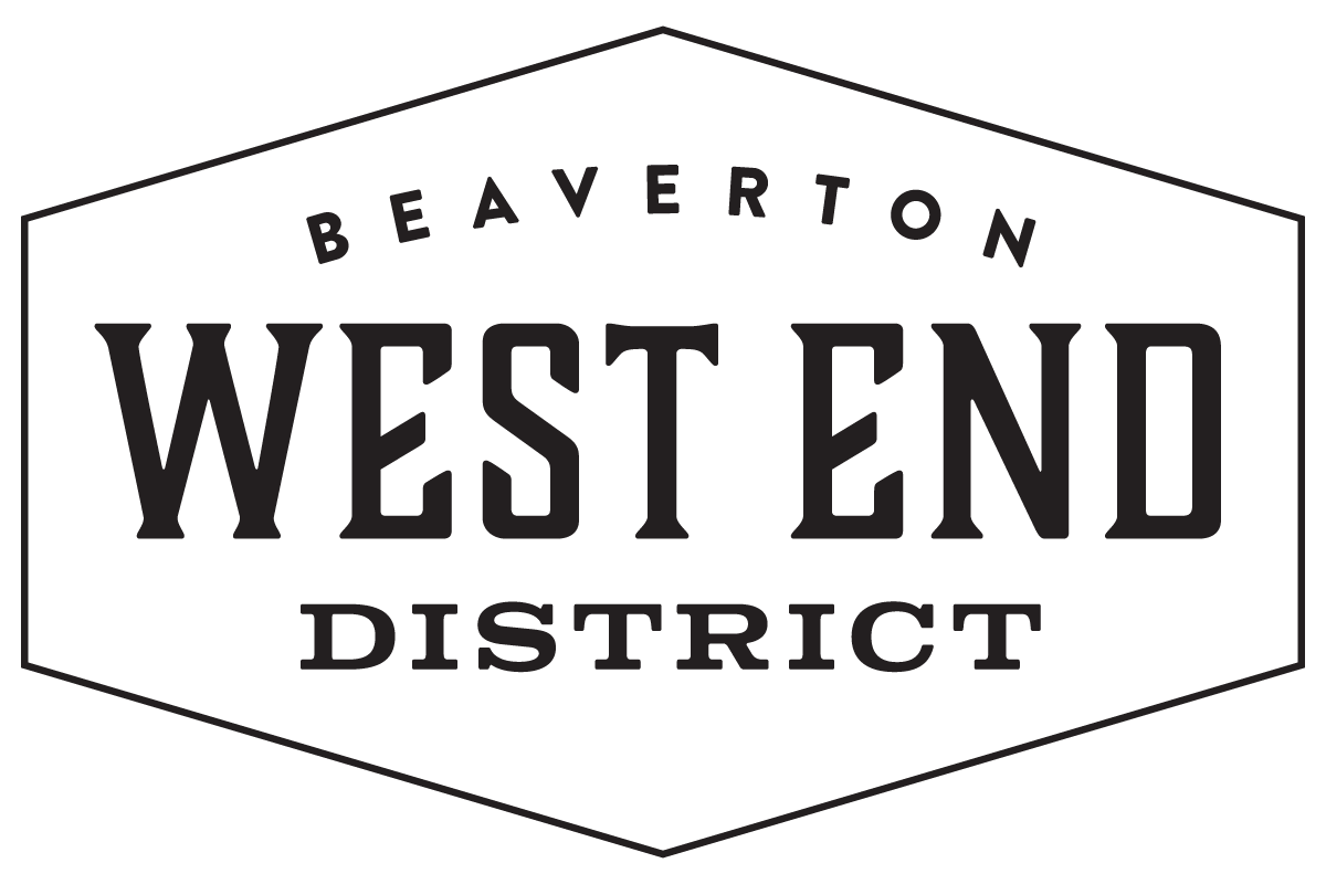 a large white hexagon with the words west end district in black