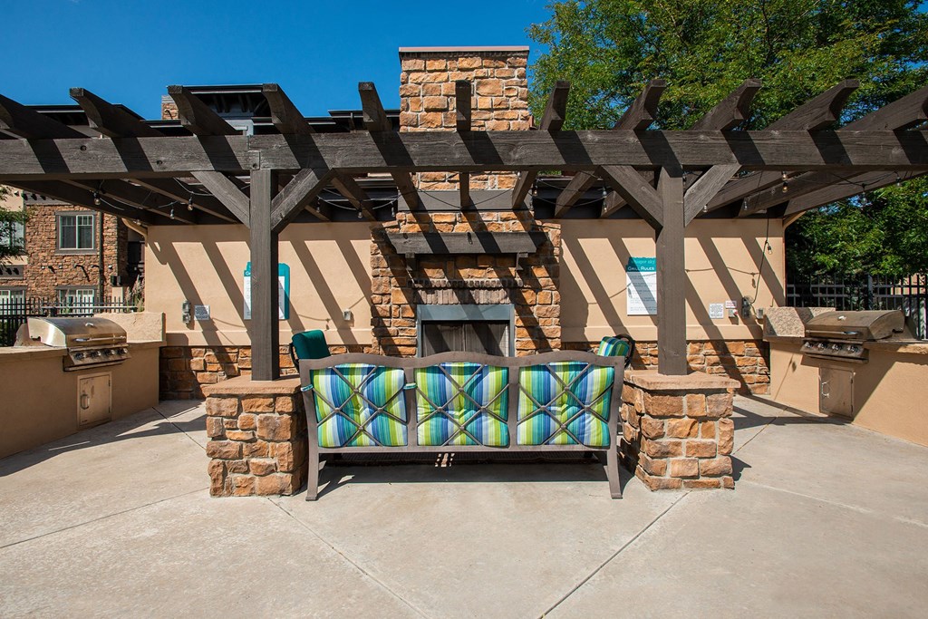 Whisper Sky Apartments Outdoor Fireplace and Seating Area