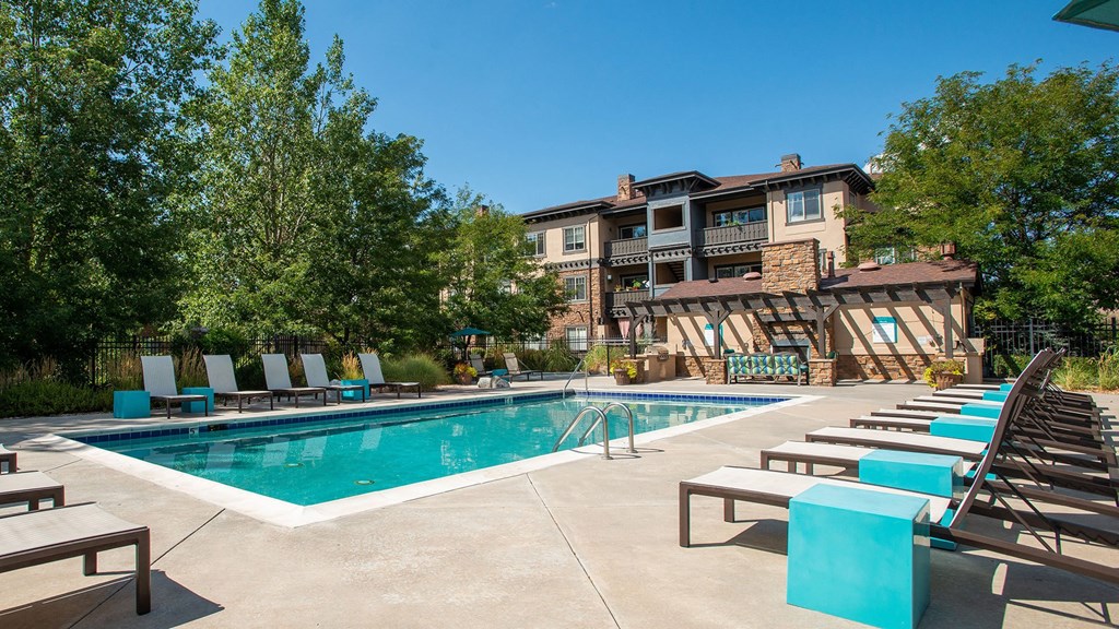 Whisper Sky Apartments Pool Area and Lounge Chairs