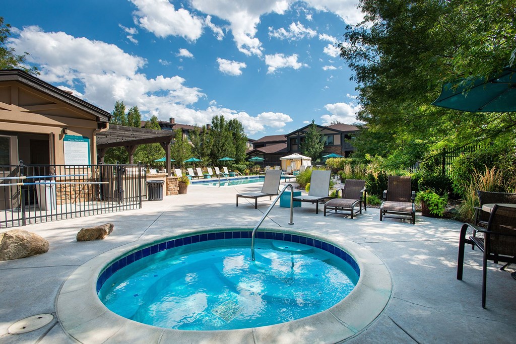 Whisper Sky Apartments Spa Area and Lounge Chairs