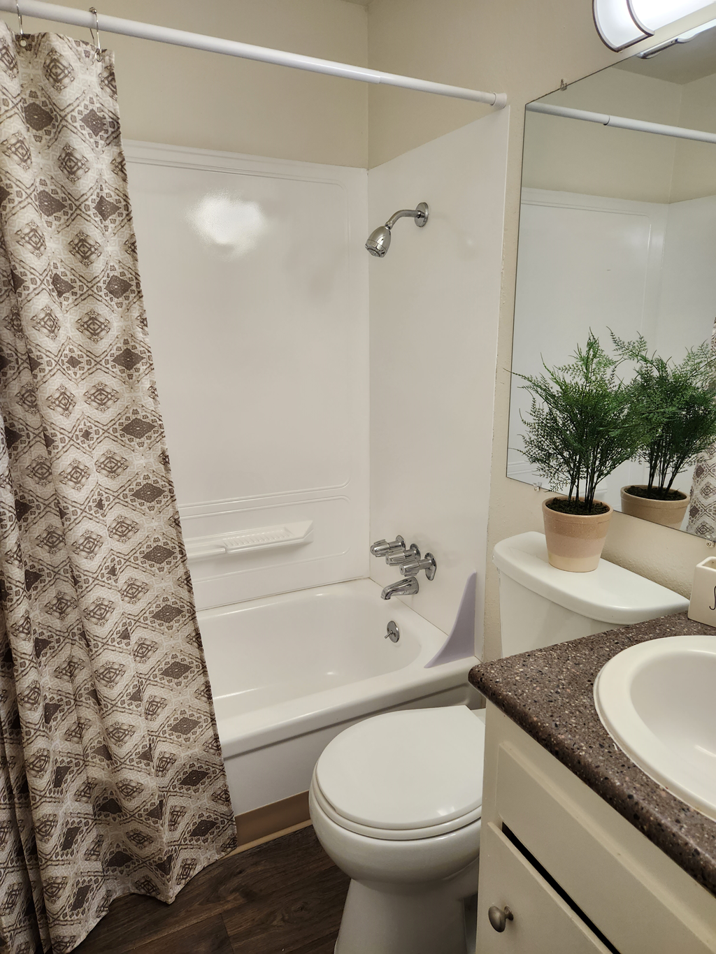Wisteria Walk bathroom with a toilet sink and bathtub