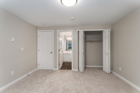 Novela Apartments Bedroom with Bathroom Door