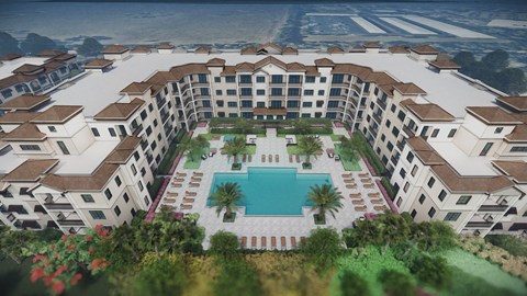 A large white building with a pool in the middle of it.