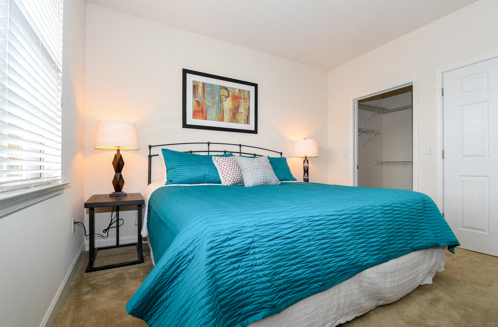 a bedroom with a bed and a closet