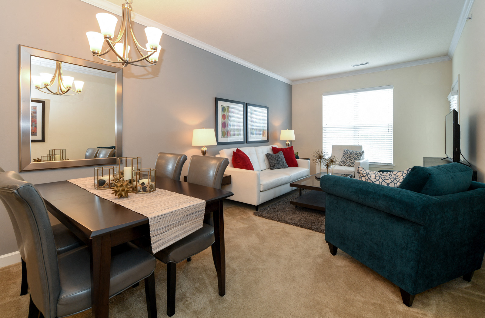 a living room and dining room with a couch and a table