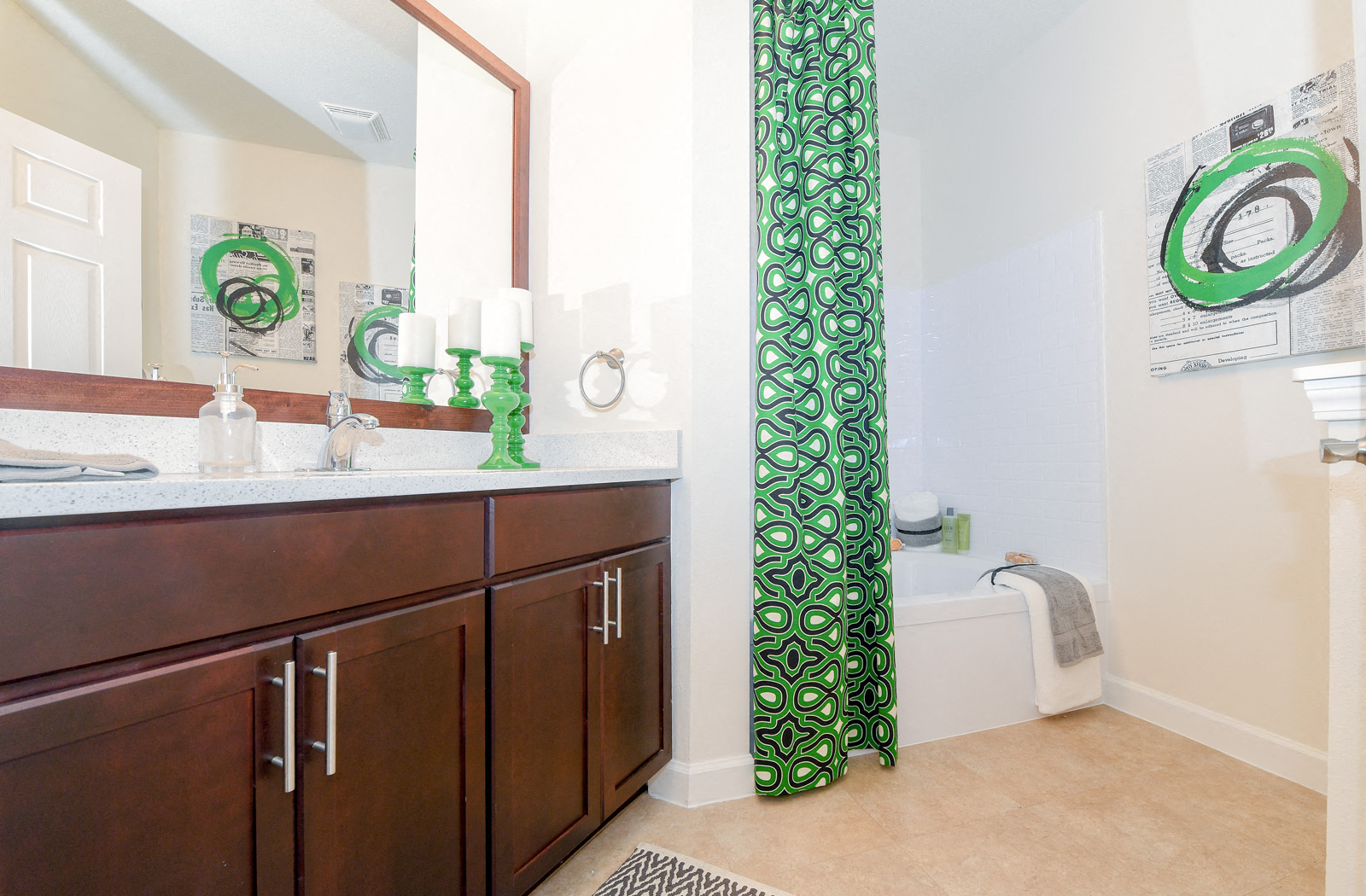 a bathroom with wooden cabinets and a green shower curtain
