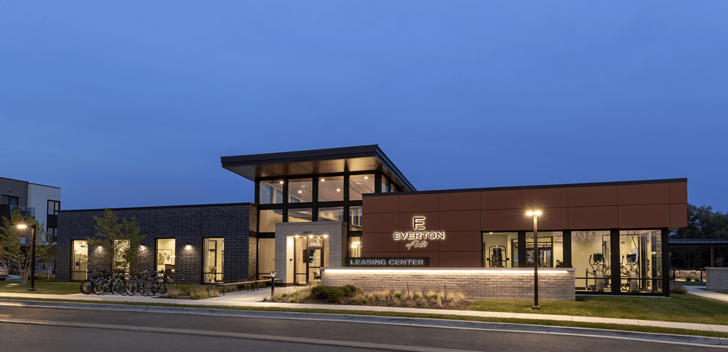 a building with a sign on the front of it at night