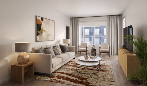 A living room with a couch, a coffee table, and a painting on the wall.
