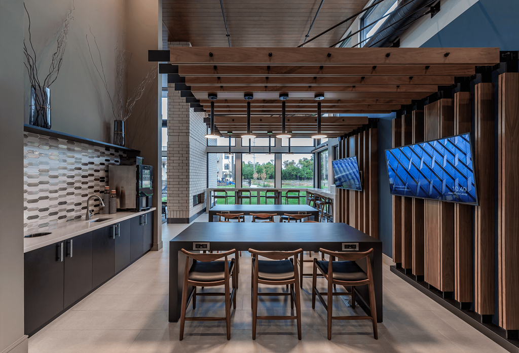 a large dining room with a large table and chairs