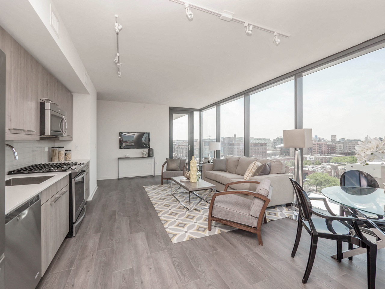 Chicago, IL Apartments - The Parker Fulton Market Apartments Spacious, Open-Concept Living Room with Wood Floorings, Floor to Ceiling Windows, and Obstructed Chicago Views