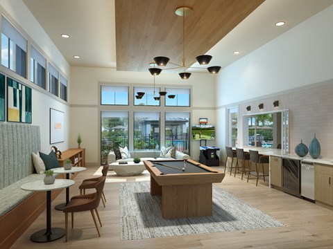 A modern living room with a pool table and a kitchen area.