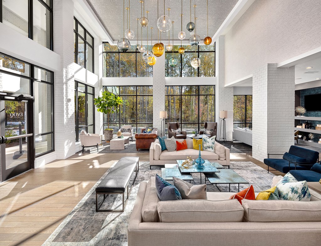 A modern living room with a large sectional sofa and a coffee table.